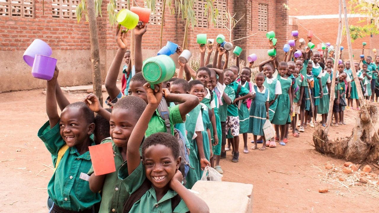 Children receiving a school meal as part of the Mary’s Meals programme